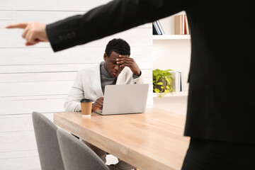 African American man suffering from racial discrimination at work