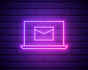 Glowing neon line Laptop with envelope and open email on screen icon isolated on brick wall background. Email marketing, internet advertising concepts. Colorful outline concept. Vector