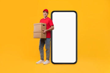 Deliveryman Near Big Smartphone Screen Holding Cardboard Boxes, Yellow Background