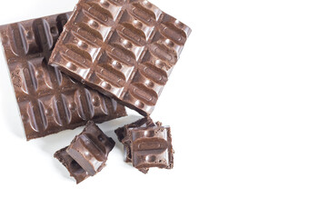Slices of airy chocolate on a light background top view of the place for the text.