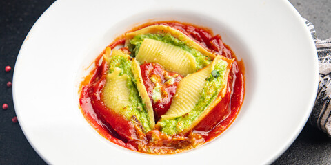 pasta stuffing spinach and cheese conchiglie garnish ready to eat durum wheat healthy meal food snack on the table copy space food background rustic veggie vegan or vegetarian food no meat