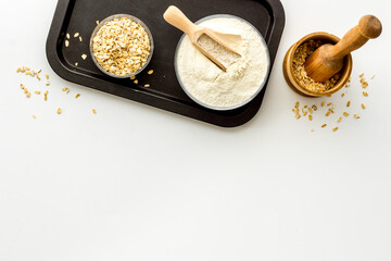 Oat flour in bowl - gluten free flour for baking