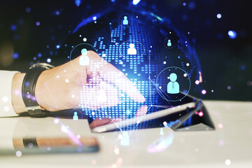 Social network concept with world map and finger clicks on a digital tablet on background. Multiexposure