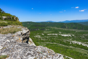 Fototapeta premium View of the picturesque Crimean mountains from the cave town of Tepe-Kermen in summer. May. 2021. Crimea. Russia.