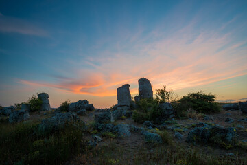Obraz premium Beautyful sunrise over The Stone Desert Pobiti Kamani - fabulous rock phenomenon in Varna Province, Bulgaria - tourist destination