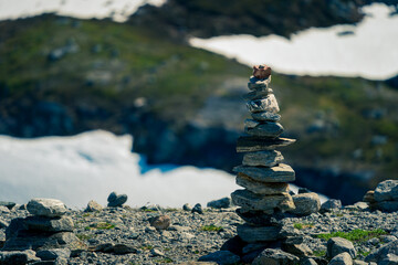 Stones balanced on the rock. Pyramid of river stones on of one another.
