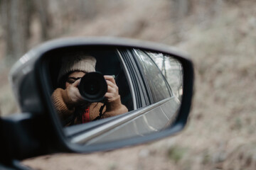 woman taking a picture  to the mirror