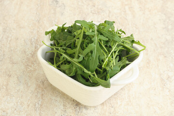 Fresh green arugula in the bowl