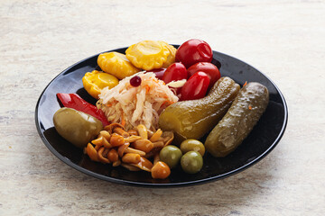 Plate with pickled vegetables and mushrooms