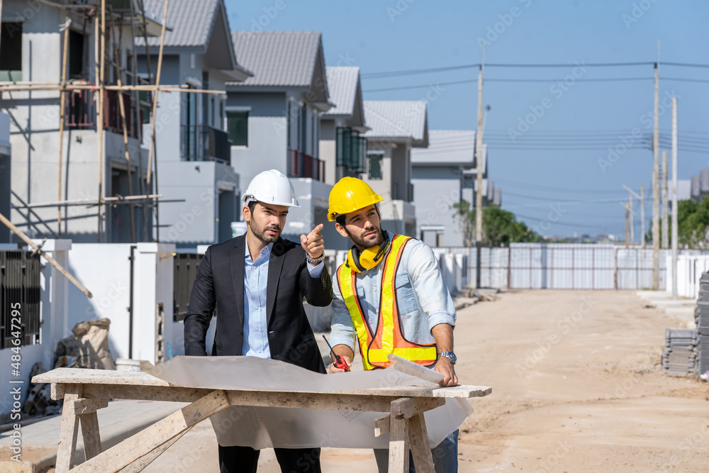 Aufkleber architectural engineer meeting and working with blueprints at construction site,discussing,designing