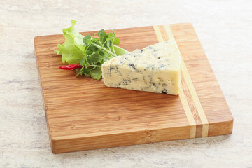 Blue cheese piece over board