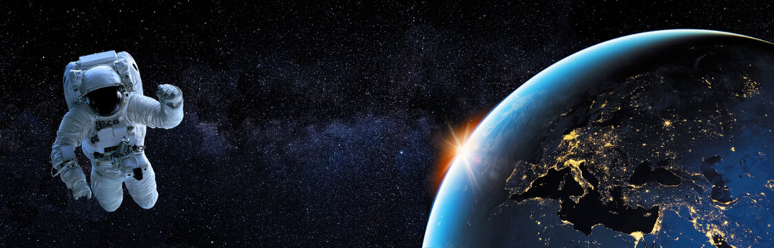 BANNI&Egrave;RE DE L'EUROPE LA NUIT AVEC ASTRONAUTE. Elements of this image furnished by NASA