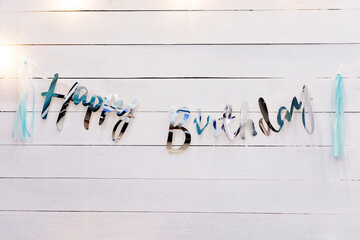 Creative inscription Happy Birthday on the background of white boards