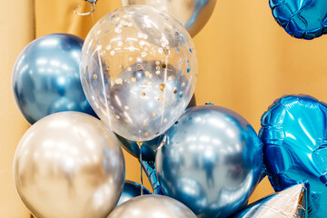 Holiday balloons on a warm background close-up
