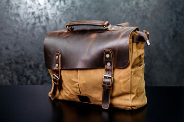 Brown bag with leather on a dark background