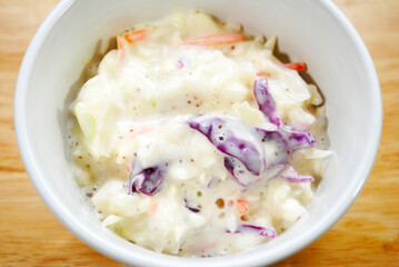 Fresh Cabbage Coleslaw Served in a White Bowl	