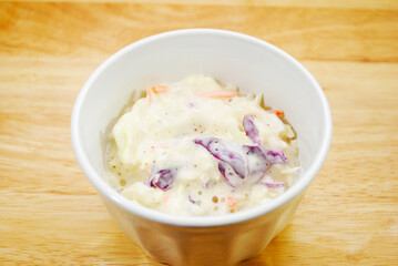 Fresh Cabbage Coleslaw Served in a White Bowl	