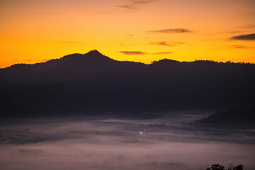 Sunrise and The Mist with Mountain Background , Landscape at Phu Langka, Payao Province, Thailand.