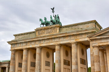 Berlin, Germany, August 18, 2021. Brandenburg Gate with statue and cloudy sky in the background.