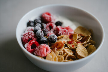 Healthy breakfast with berries, cereals and natural yogurt.