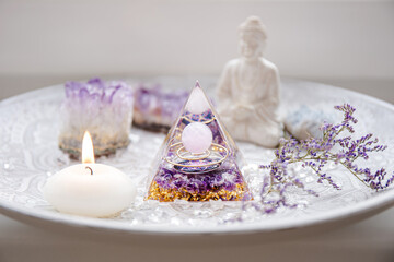 Small altar with Orgonite or Orgone pyramid in home interior. Converting negative energy to...