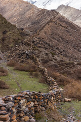 Fence of stones high in the Himalayan mountains