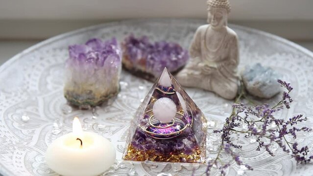 Small altar with Orgonite or Orgone pyramid in home interior. Converting negative energy to positive energy and have healing powers.