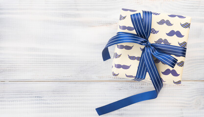 Gift for a man on a wooden background