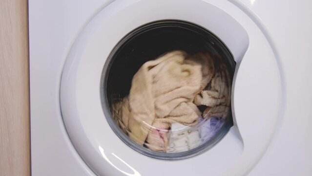 Washing process in a side loading washing machine. 4K static footage