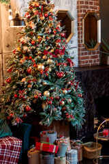 Fototapeta na wymiar Christmas tree decorated with red toys
