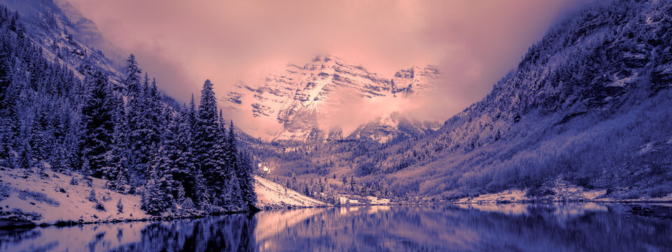 Aspen Maroon bells mountain range in Colorado winter snow covered weather in the National Park  
