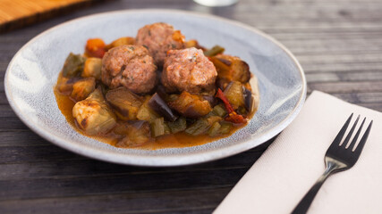 steamed meatballs with stewed vegetables with haze on plate