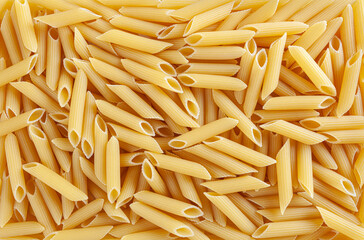 Uncooked penne pasta background - obrazy, fototapety, plakaty