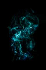 Green smoke pattern, beautiful puffs of smoke from cigarettes and hookah in the dark