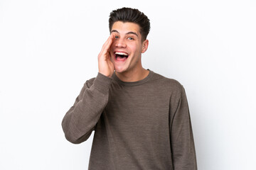 Young handsome caucasian man isolated on white bakcground with surprise and shocked facial expression