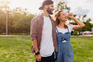 Fototapeta premium young pretty hipster couple walking in park