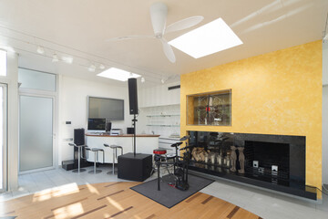 Modern interior of luxury private house. Musical equipment. Drum kit.
