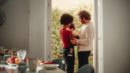 Loving Mixed Race Family Playing with Adorable Baby Boy at Modern Home, Holding Child. Cheerful...