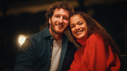 Loving Mixed Race Couple Sitting Together on an Outdoors Terrace on a Warm Summer Evening. Beautiful Caucasian Ginger Man and Black Woman with Afro Hair Pose for Camera, Relax on Weekend and Have Fun.