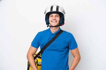 Young caucasian man with thermal backpack isolated on white background laughing
