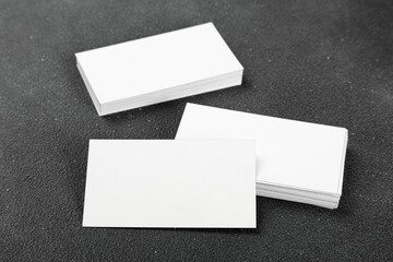 Photos of business cards. Mock-up for corporate identity on a black background. For graphic designers presentations and portfolios