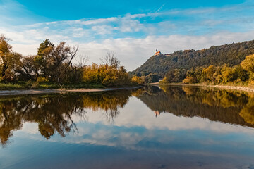Beautiful autumn or indian summer view with reflections at the famous Bogenberg, Danube, Bavaria, Germany