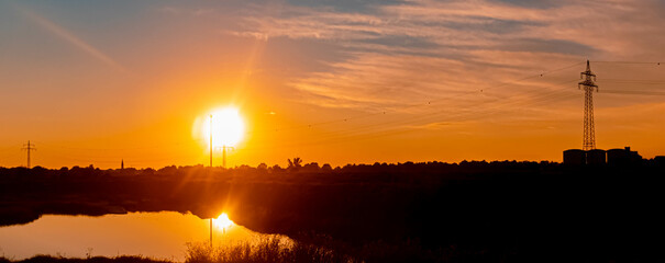 Beautiful sunset with reflections near Plattling, Isar, Bavaria, Germany