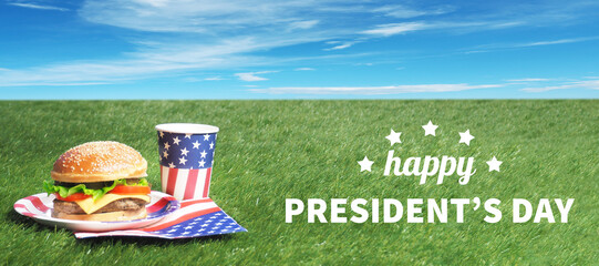 Burger and drinks on green grass. Outdoor.USA flag. Happy presidents day.