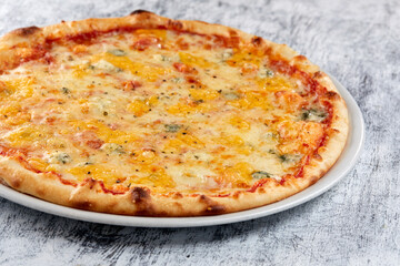 fresh pizza on the white plate