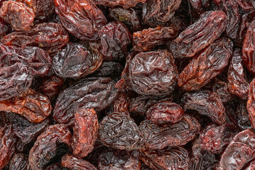 Dark raisins as background. Top view, food background