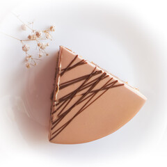 a piece of cheesecake on a white table. space for text