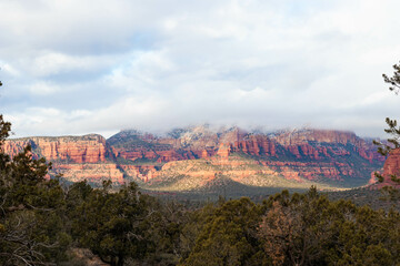 Fototapeta premium Landscape of Sedona in winter with the red mountains with snow