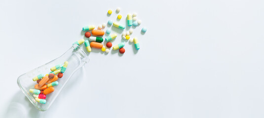 science pills and bottles on white background,
Medical: Pills and bottle, aerial view.
Composition of the medical flasks 