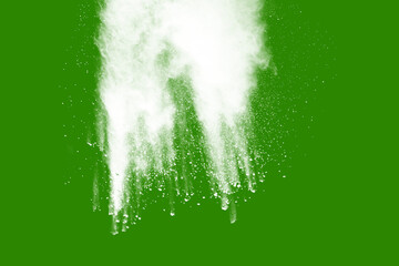 Explosion of white powder isolated on green background. Abstract colored background. holi festival.